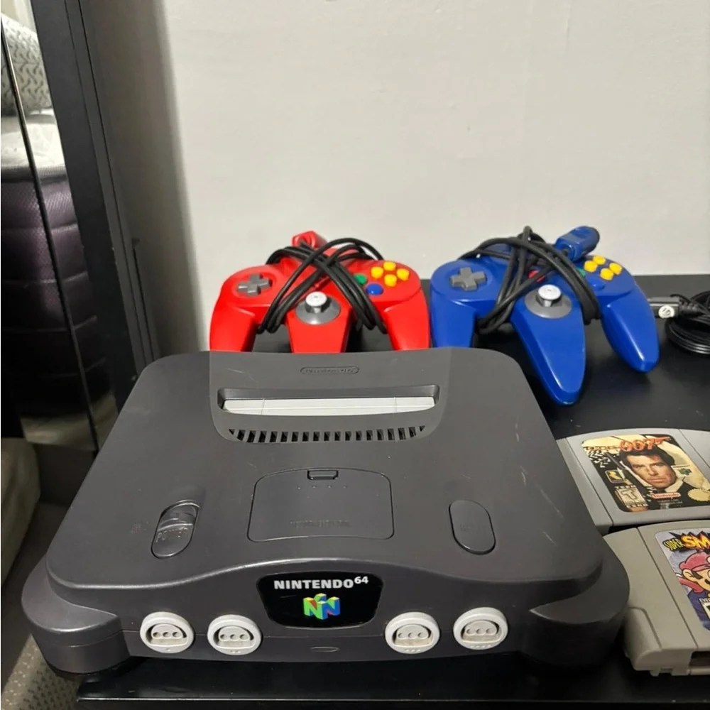 Nintendo Gray Console with Controllers and Game Cartridges